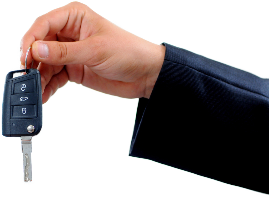 a man in suit handing over the car key