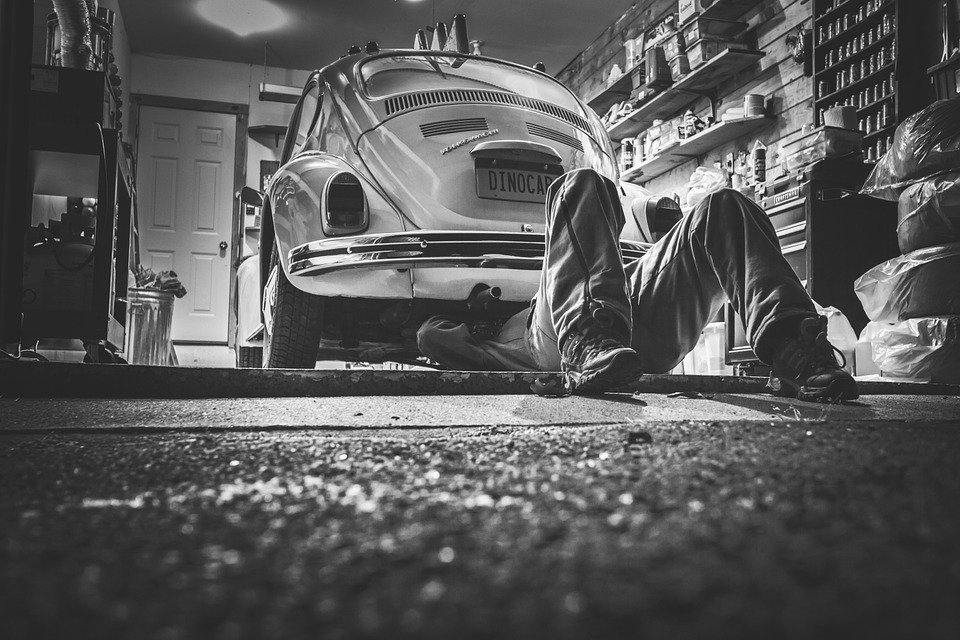 Mechanic checking a car condition